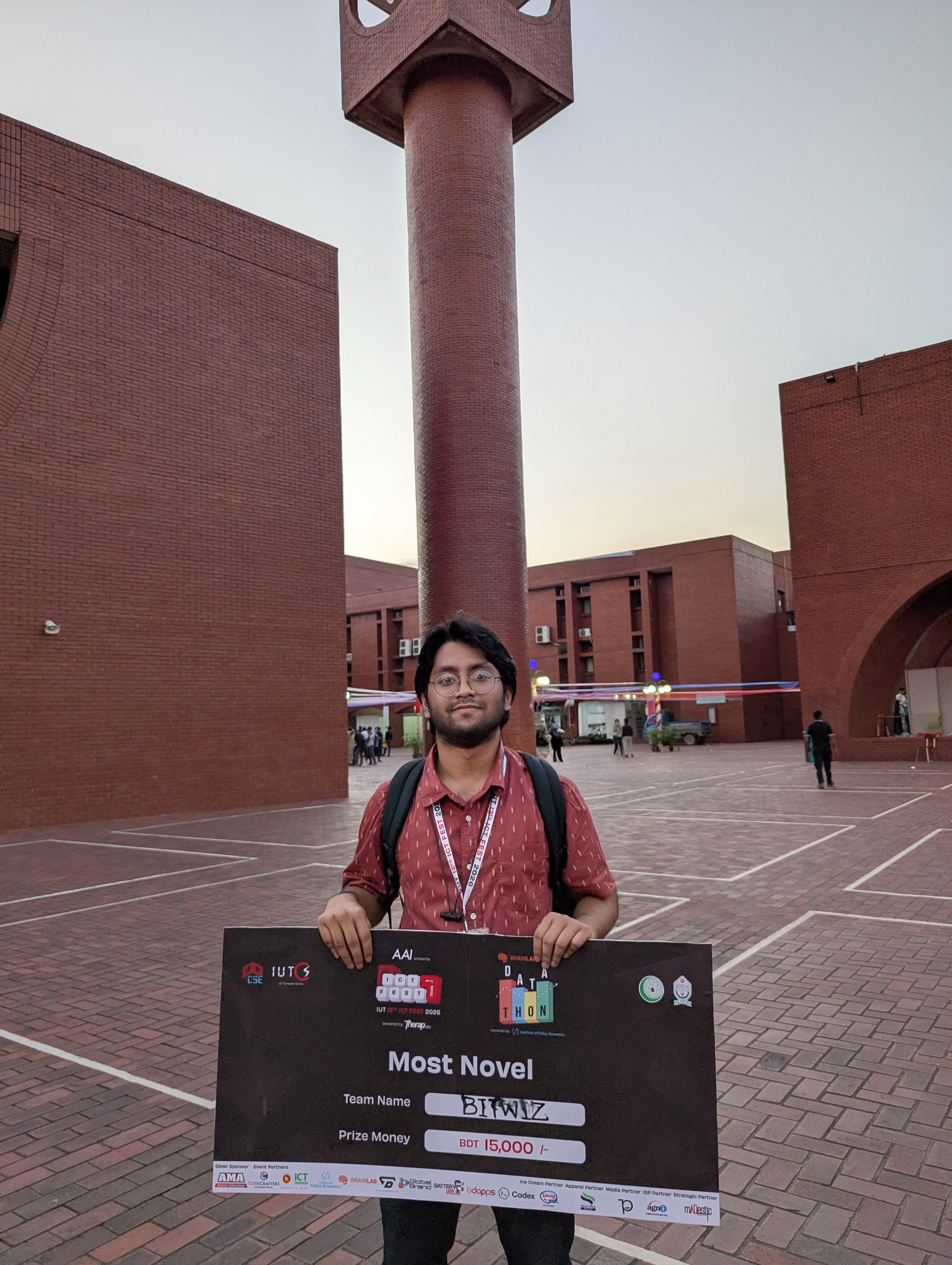 Afham Adian holding the Most Novel Idea prize at the IUT Datathon